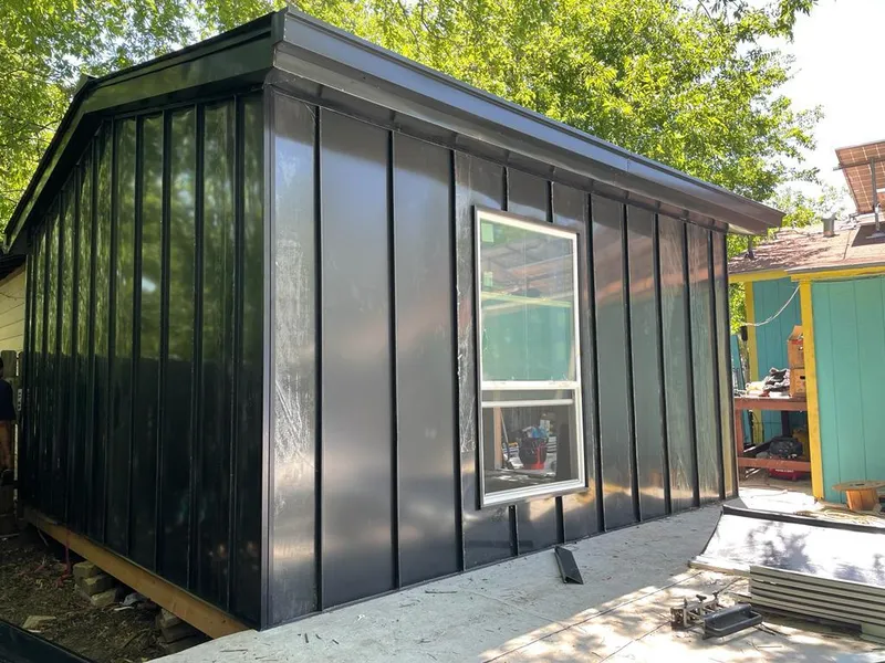 Black standing seam metal wall panels for Roof Inspection in New Franklin